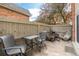 Charming outdoor patio with a table, chairs, and a tranquil ambiance at 4663 S Lowell Blvd, Denver, CO 80236