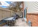 Charming outdoor patio with a table, chairs, and a tranquil ambiance at 4663 S Lowell Blvd, Denver, CO 80236