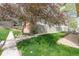 Lush front yard with mature landscaping and a serene atmosphere at 4663 S Lowell Blvd, Denver, CO 80236