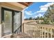 Balcony with a view of green space, pine trees, and blue sky at 6598 Pinewood Dr # 74, Parker, CO 80134