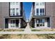 Modern townhouse exteriors featuring clean lines, brick accents, and a well-manicured walkway at 3043 W 19Th Ave, Denver, CO 80204