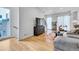 Inviting living room featuring hardwood floors, large TV, and modern furnishings for relaxing at 3043 W 19Th Ave, Denver, CO 80204