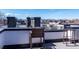 Spacious rooftop deck with outdoor seating, perfect for enjoying city views at 3043 W 19Th Ave, Denver, CO 80204
