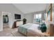 Bright bedroom features a vaulted ceiling, hardwood floors, and walk-in closet for ample storage at 11101 E Alameda Ave # 202, Aurora, CO 80012