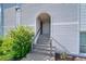 Inviting entrance with steps leading to the front door and units with a well maintained landscaped bush at 11101 E Alameda Ave # 202, Aurora, CO 80012