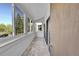 Enclosed sunroom with multiple windows offering bright views of nature and nice flooring at 11101 E Alameda Ave # 202, Aurora, CO 80012