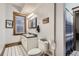 Bright bathroom featuring dual sinks, mosaic tile floor, and natural light at 1210 E Colfax Ave # 206, Denver, CO 80218