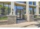 Elegant building entrance with grand columns at Colonnade Lofts at 1210 at 1210 E Colfax Ave # 206, Denver, CO 80218