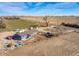 Expansive property featuring a charming home, outbuildings, and wide-open spaces at 16491 County Road 32, Platteville, CO 80651