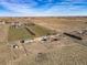 Overhead shot of a property, including the home, outbuildings, and adjacent land at 16491 County Road 32, Platteville, CO 80651