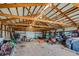 Inside the barn with wood beams, offering ample storage and workspace at 16491 County Road 32, Platteville, CO 80651