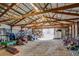 Spacious barn interior with high ceilings, rafters, and ample storage space at 16491 County Road 32, Platteville, CO 80651