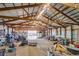 Inside the barn with a metal roof and exposed wood beams, providing ample storage space at 16491 County Road 32, Platteville, CO 80651