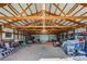 Large barn with trusses and high ceilings, offering plenty of room for storage at 16491 County Road 32, Platteville, CO 80651