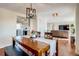 Cozy dining room with wood table and chairs, flows into the living room at 16491 County Road 32, Platteville, CO 80651