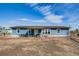 Charming blue home featuring an inviting patio and a well-maintained landscape at 16491 County Road 32, Platteville, CO 80651