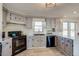 Modern kitchen featuring sleek appliances, ample counter space, and stylish cabinetry at 16491 County Road 32, Platteville, CO 80651