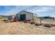 Spacious outbuilding and land ideal for agricultural pursuits or equipment storage at 16491 County Road 32, Platteville, CO 80651