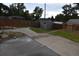 View of the backyard featuring a shed and a paved area that is surrounded by a wood fence at 5585 W 51St Pl, Denver, CO 80212