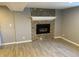 Spacious basement with tile floor and a stone fireplace feature wall at 5585 W 51St Pl, Denver, CO 80212