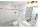 Modern bathroom featuring a tiled shower, sleek vanity, and neutral color palette at 5585 W 51St Pl, Denver, CO 80212