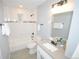 Bathroom with white subway tile, updated fixtures, and sleek vanity at 5585 W 51St Pl, Denver, CO 80212