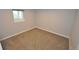 Bedroom with carpet and a view from the window at 5585 W 51St Pl, Denver, CO 80212