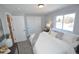 Comfortable bedroom featuring neutral walls, carpet, a window, and built-in closet at 5585 W 51St Pl, Denver, CO 80212