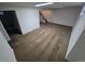 Spacious basement featuring neutral carpet, white walls, and stairwell leading to the main level at 12063 E Arizona Dr, Aurora, CO 80012