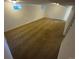 Spacious basement featuring neutral carpet, window, and white walls, perfect for flexible living or storage at 12063 E Arizona Dr, Aurora, CO 80012