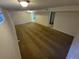 Spacious basement featuring neutral carpet and white walls, perfect for flexible living or storage at 12063 E Arizona Dr, Aurora, CO 80012