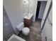 Bathroom featuring tile floors, hardwood vanity, tub, and shower at 12063 E Arizona Dr, Aurora, CO 80012