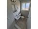 Bright bathroom featuring tile flooring, vanity and shower at 12063 E Arizona Dr, Aurora, CO 80012