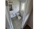 Cozy bathroom featuring a neutral color palette, tile flooring and a vanity sink at 12063 E Arizona Dr, Aurora, CO 80012