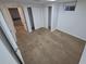 Cozy bedroom featuring neutral carpet, white walls, and closet for ample storage at 12063 E Arizona Dr, Aurora, CO 80012