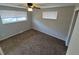 Bedroom featuring plush carpeting, window and ceiling fan at 12063 E Arizona Dr, Aurora, CO 80012
