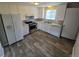 Bright kitchen with stainless steel appliances, granite countertops, and a double sink at 12063 E Arizona Dr, Aurora, CO 80012