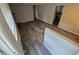 Inviting living room with wood-look floors and a brick fireplace, seamlessly blending style and warmth at 12063 E Arizona Dr, Aurora, CO 80012