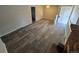 Spacious living room with modern flooring, bright natural light, and ceiling fan at 12063 E Arizona Dr, Aurora, CO 80012