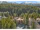 Beautiful complex nestled within a forest with views of snow-capped mountains in the distance at 805 Columbine Rd # 202, Breckenridge, CO 80424