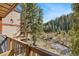 Balcony with view of the river running through the forest at 805 Columbine Rd # 202, Breckenridge, CO 80424