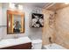 Contemporary bathroom features vanity, tiled shower, and mounted storage at 805 Columbine Rd # 202, Breckenridge, CO 80424
