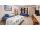 Cozy bedroom with twin beds, soft carpet and a door to the outside at 805 Columbine Rd # 202, Breckenridge, CO 80424