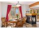 Comfortable dining room area with a fireplace and outdoor view at 805 Columbine Rd # 202, Breckenridge, CO 80424