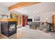 Inviting living room with fireplace and access to outdoor deck through glass doors at 805 Columbine Rd # 202, Breckenridge, CO 80424