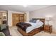 Comfortable bedroom with wood trim, a king size bed and a carpeted floor at 805 Columbine Rd # 202, Breckenridge, CO 80424
