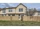 Back exterior view of this property, which includes a wooden fence providing privacy at 9618 W Chatfield Ave # B, Littleton, CO 80128