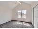 Bedroom featuring vaulted ceilings, carpet flooring, and abundant natural light from bright windows at 9618 W Chatfield Ave # B, Littleton, CO 80128