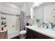 Bathroom with shower-tub, vanity and sink, and decorated with elegant decor and neutral colors at 226 S Shady Grove Ct, Aurora, CO 80018