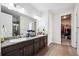 Bathroom featuring double sinks, granite countertops, and a separate shower at 226 S Shady Grove Ct, Aurora, CO 80018